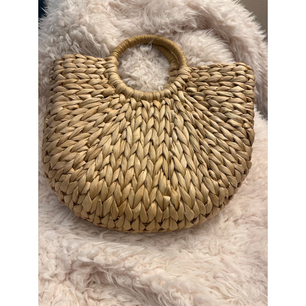 Straw tote handbag, bohemian-style summer piece with hand-woven construction.